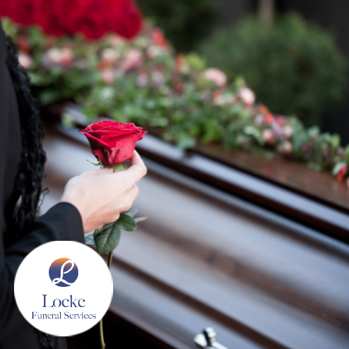 Woman holding red rose near casket